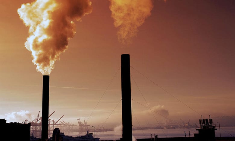 Pipes pumping smoke pollution into the air